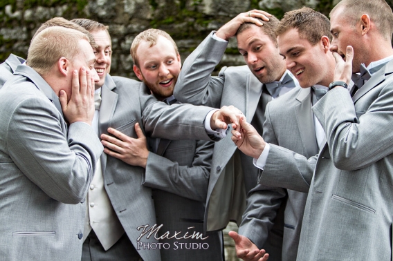 Cincinnati wedding groom with fun ring shot
